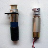 Note the new larger motor and gearbox compared to OEM motor (right).