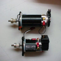 Note the new larger motor (top), compared to the OEM motor.